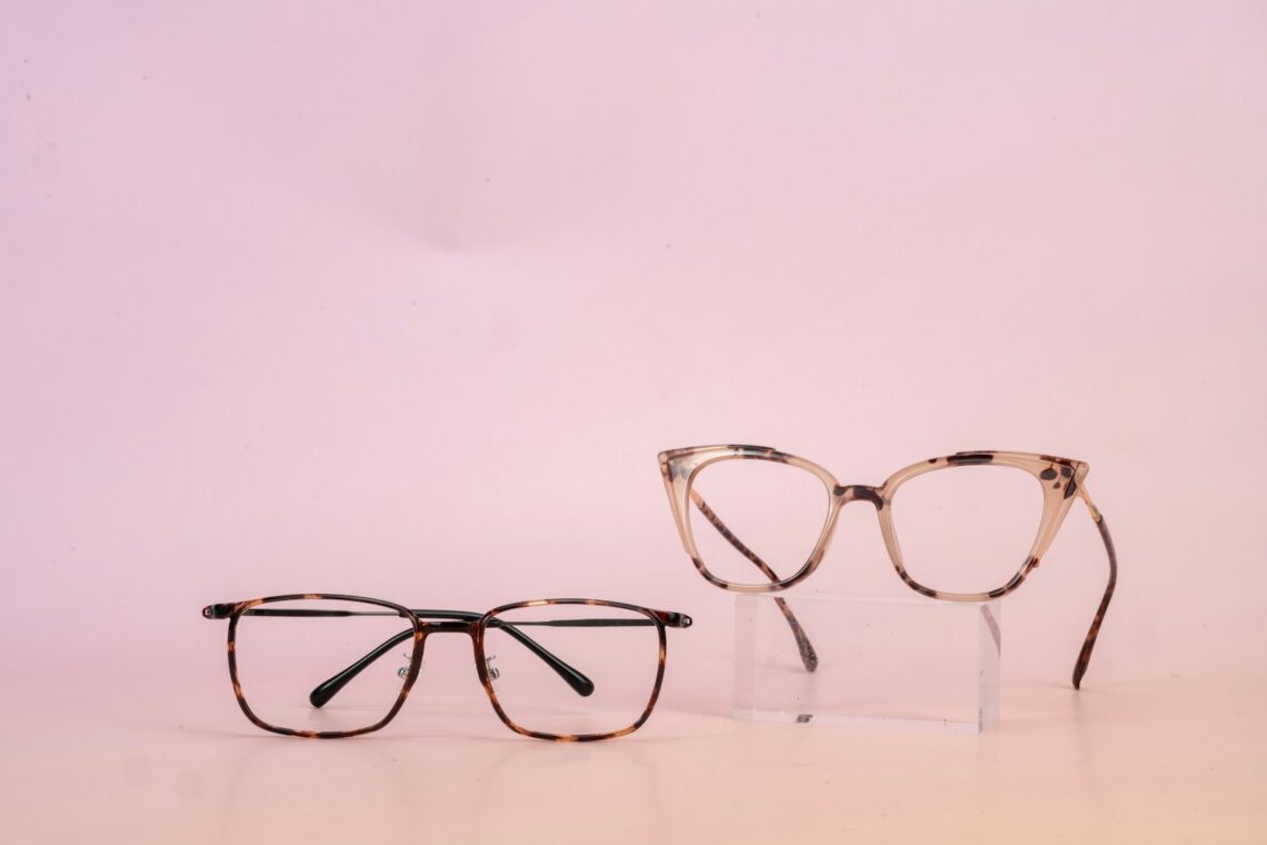 A pair of glasses sitting on top of a table