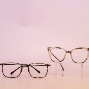A pair of glasses sitting on top of a table